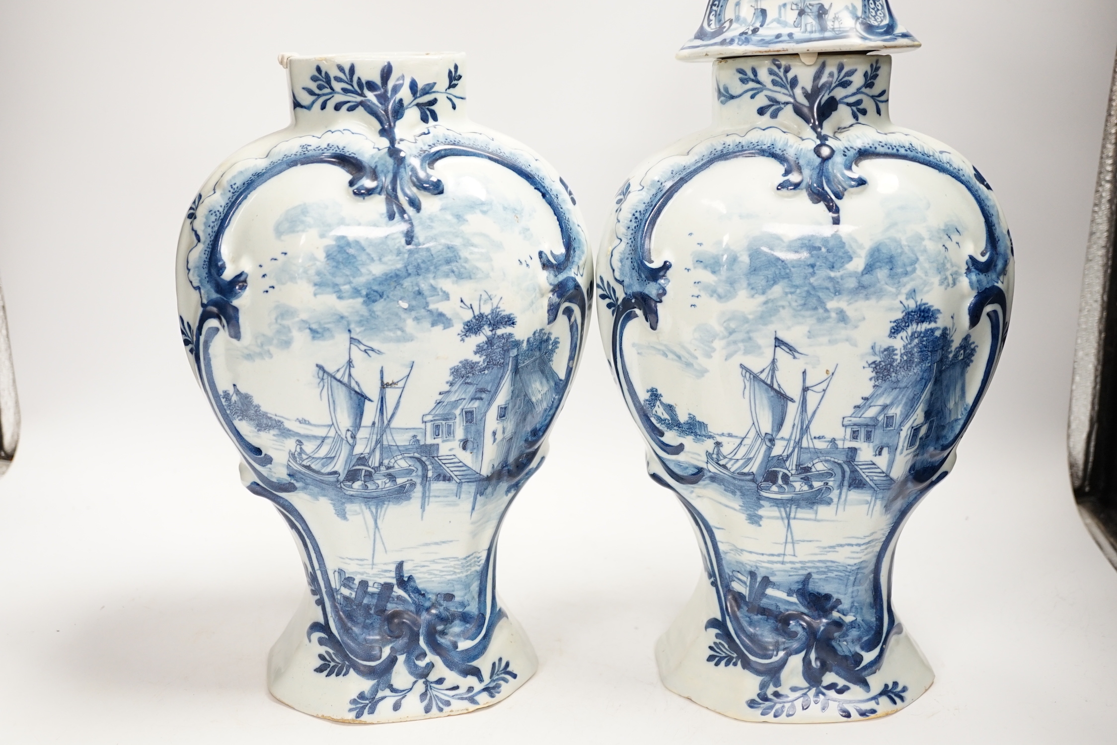 A Delft garniture of three vases, c.1770, tallest 41cm high